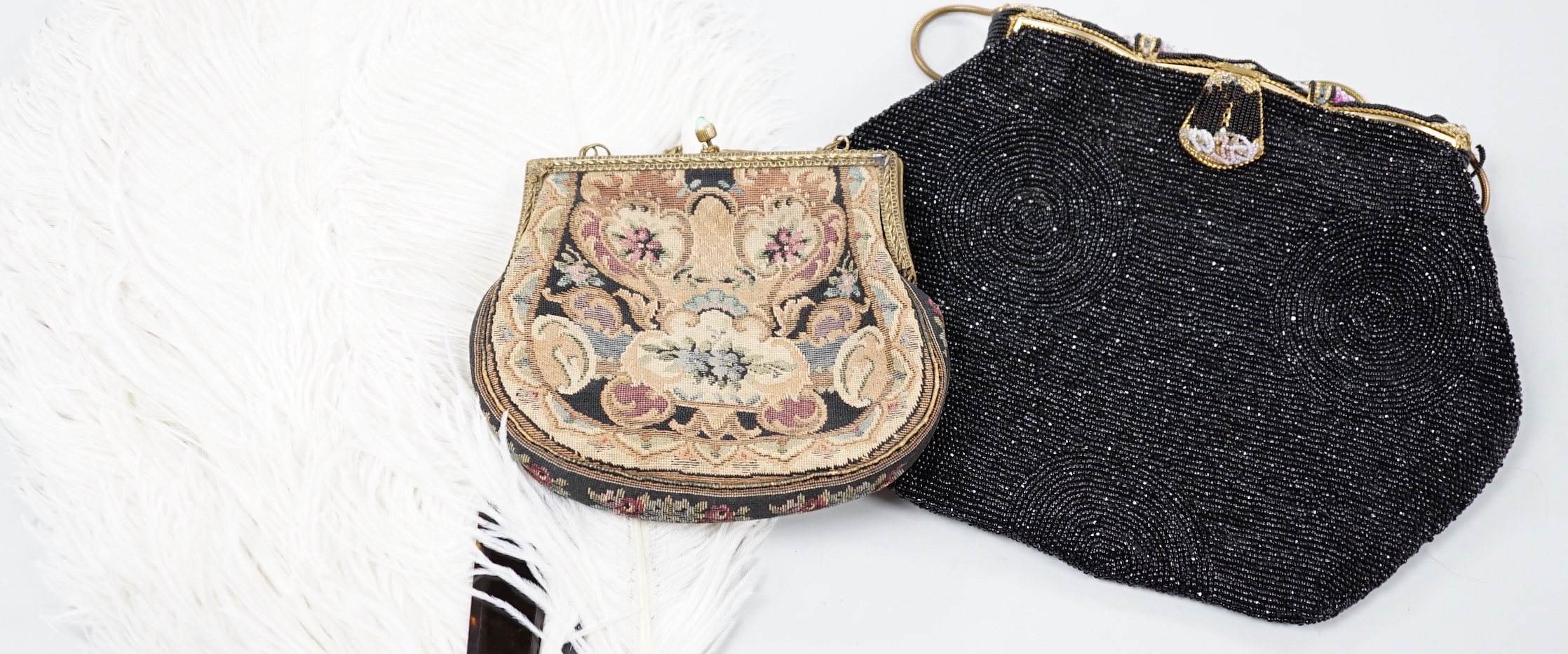 A beadwork bag and a petit point bag with a tortoiseshell and ostrich feather fan, bead bag 19cm high